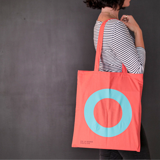 Bright coral canvas bag featuring the DLWP roundel in aqua blue