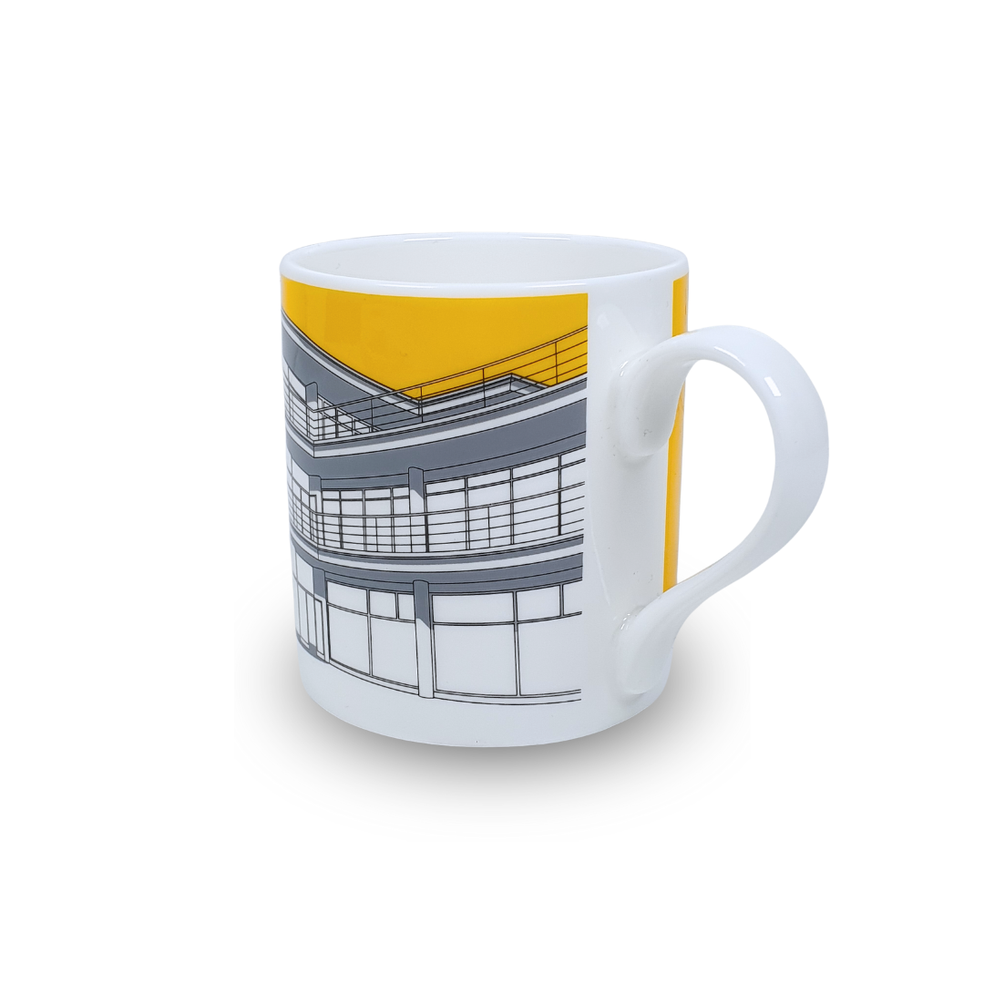 White mug with grey illustration of De La Warr Pavilion with a yellow background