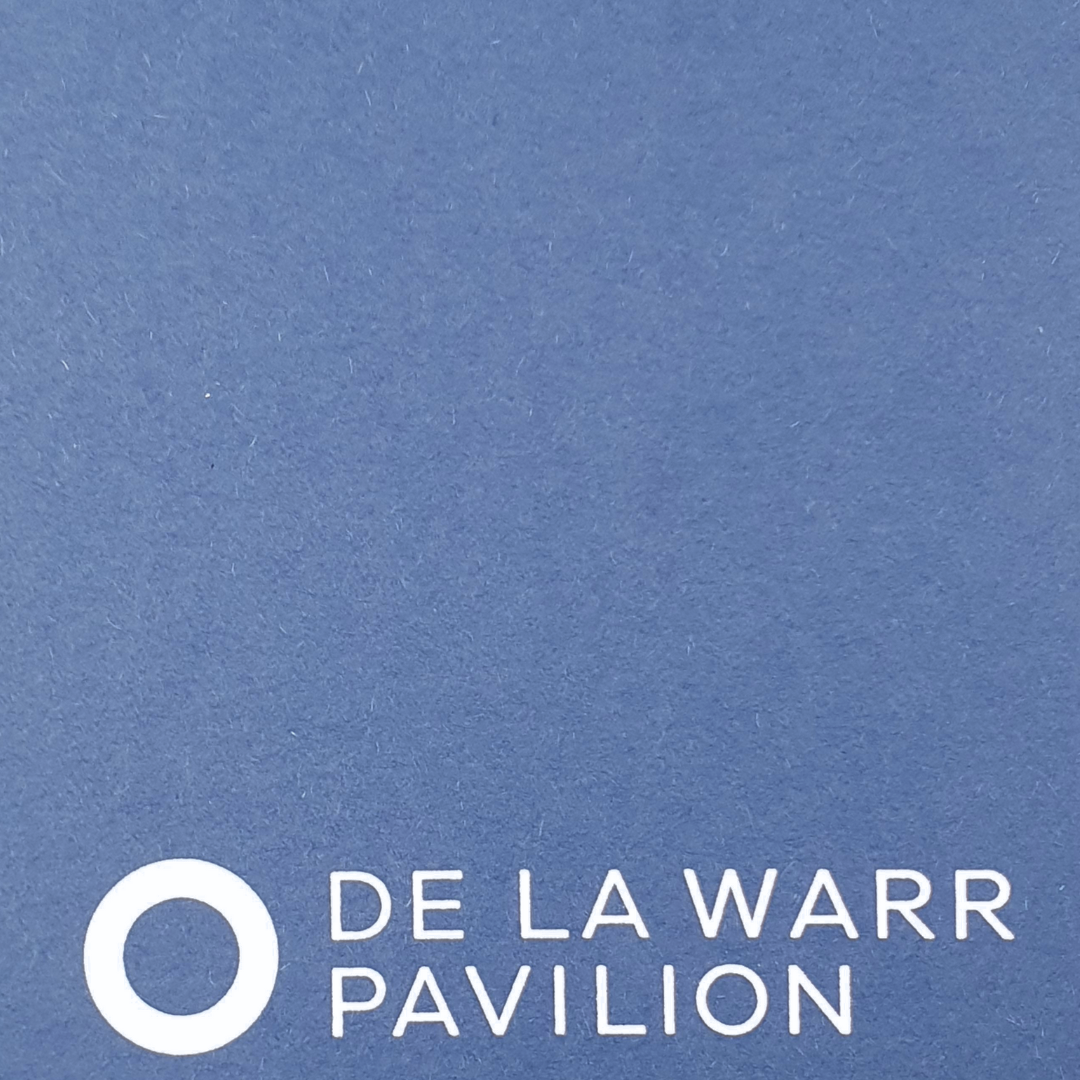 Close up of Blue A5 De La Warr Pavilion branded notebook