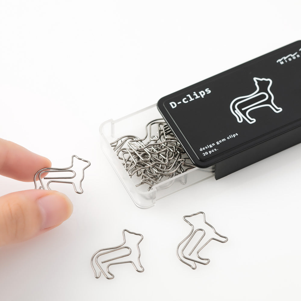 Cat shaped paper clips in slide-open black box.