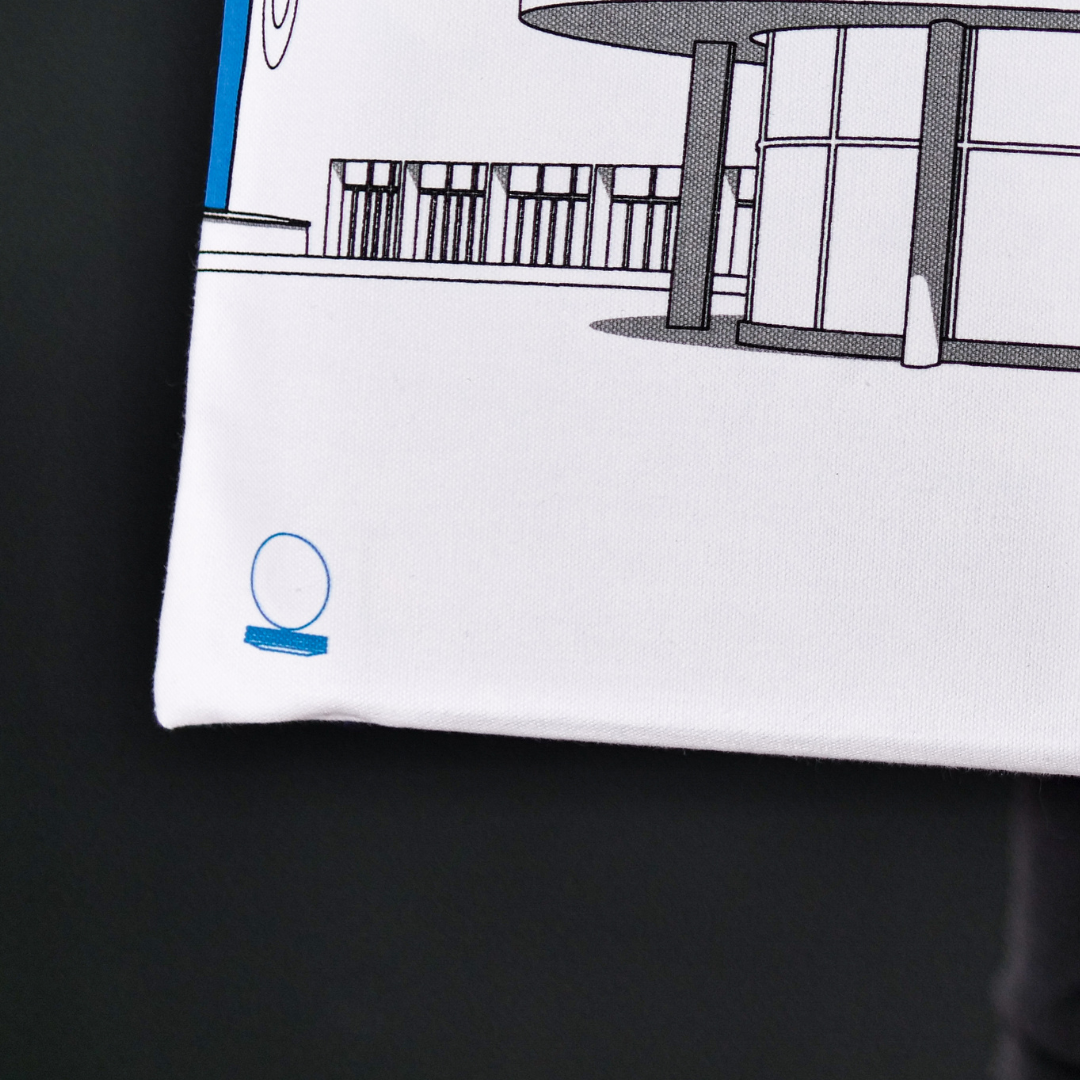 Blue canvas bag with grey illustration of De La Warr Pavilion