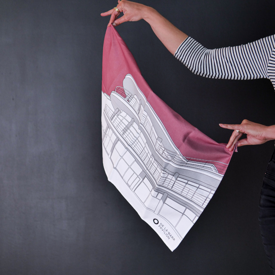 Hands holding a dusty rose tea towel