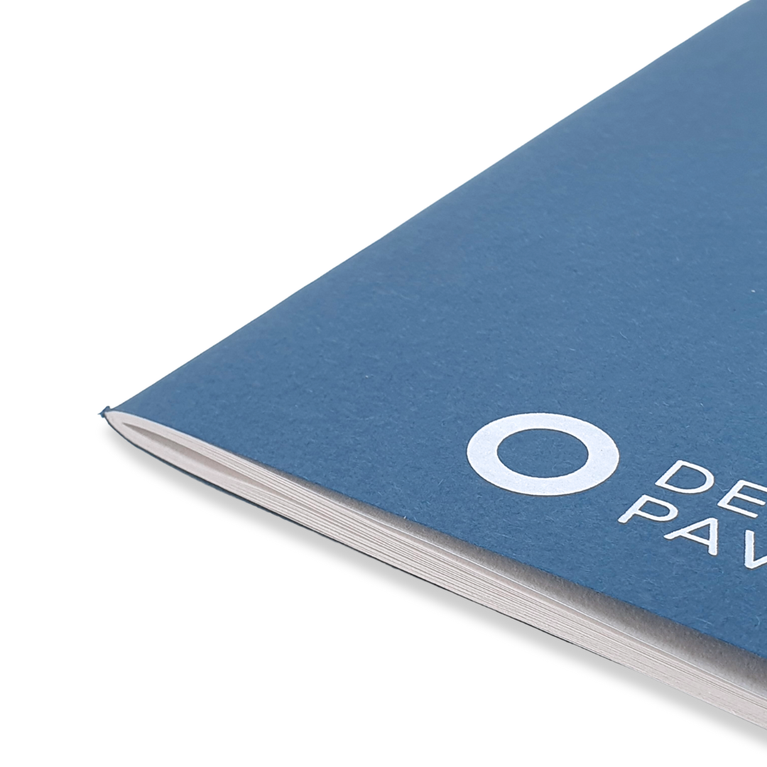 Close up of Blue A5 De La Warr Pavilion branded notebook