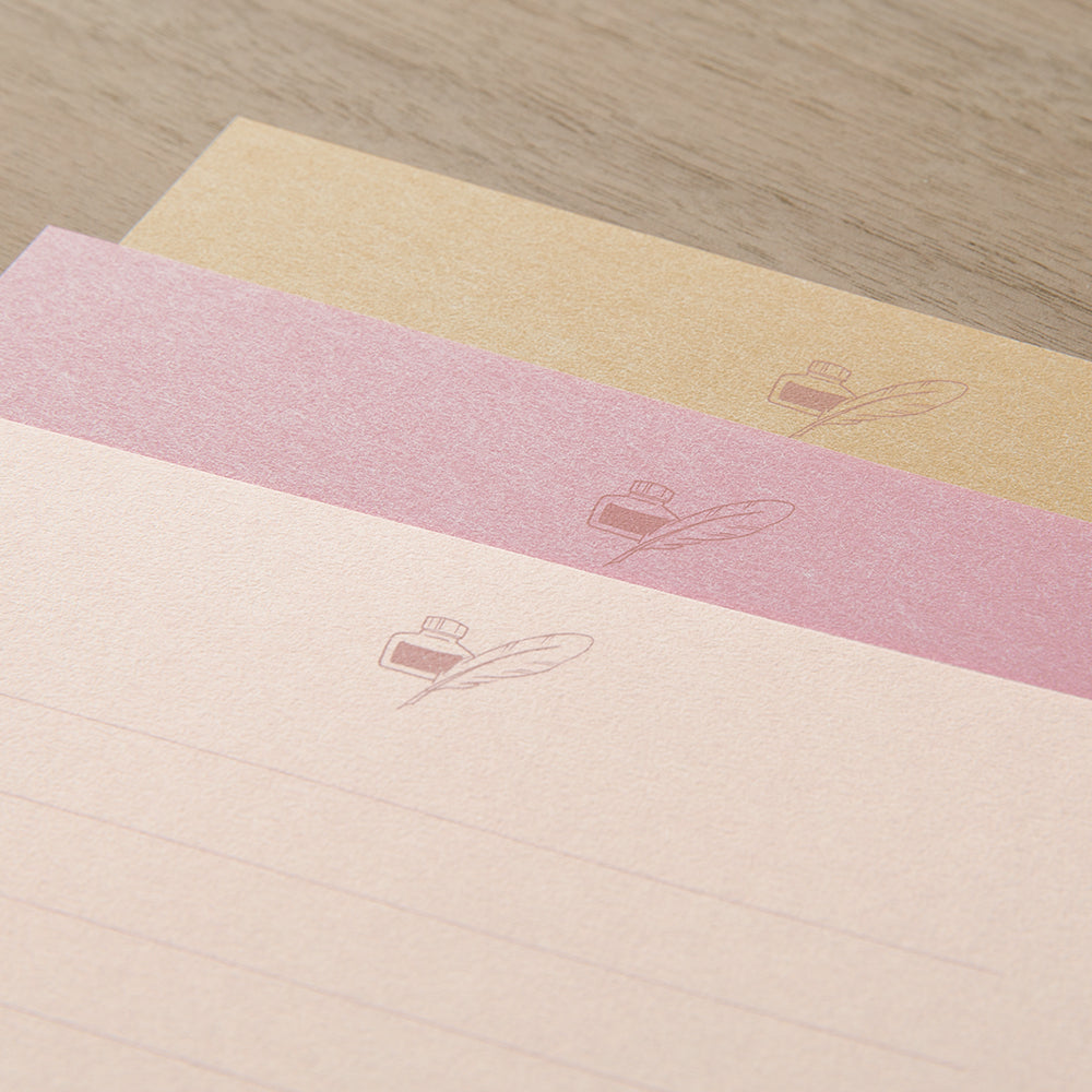 three sheets of letter paper in different shades of pink