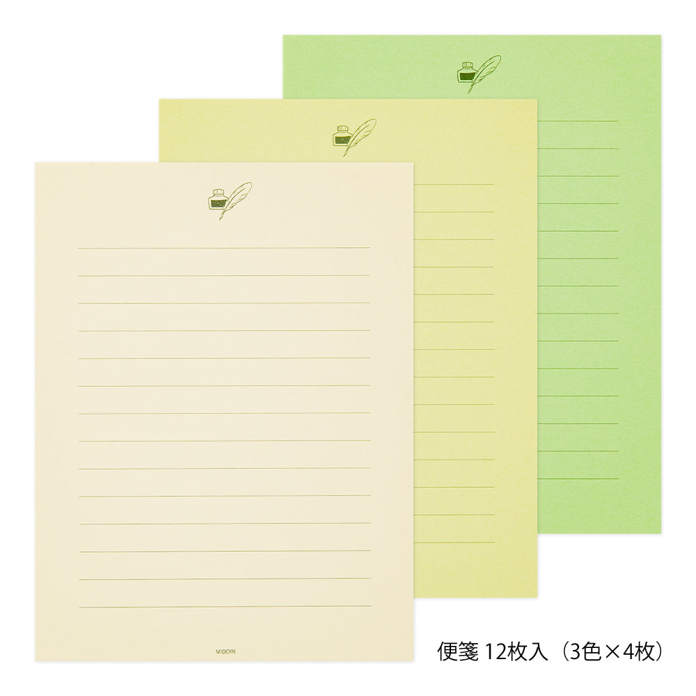 Three sheets of writing paper in different shades of green