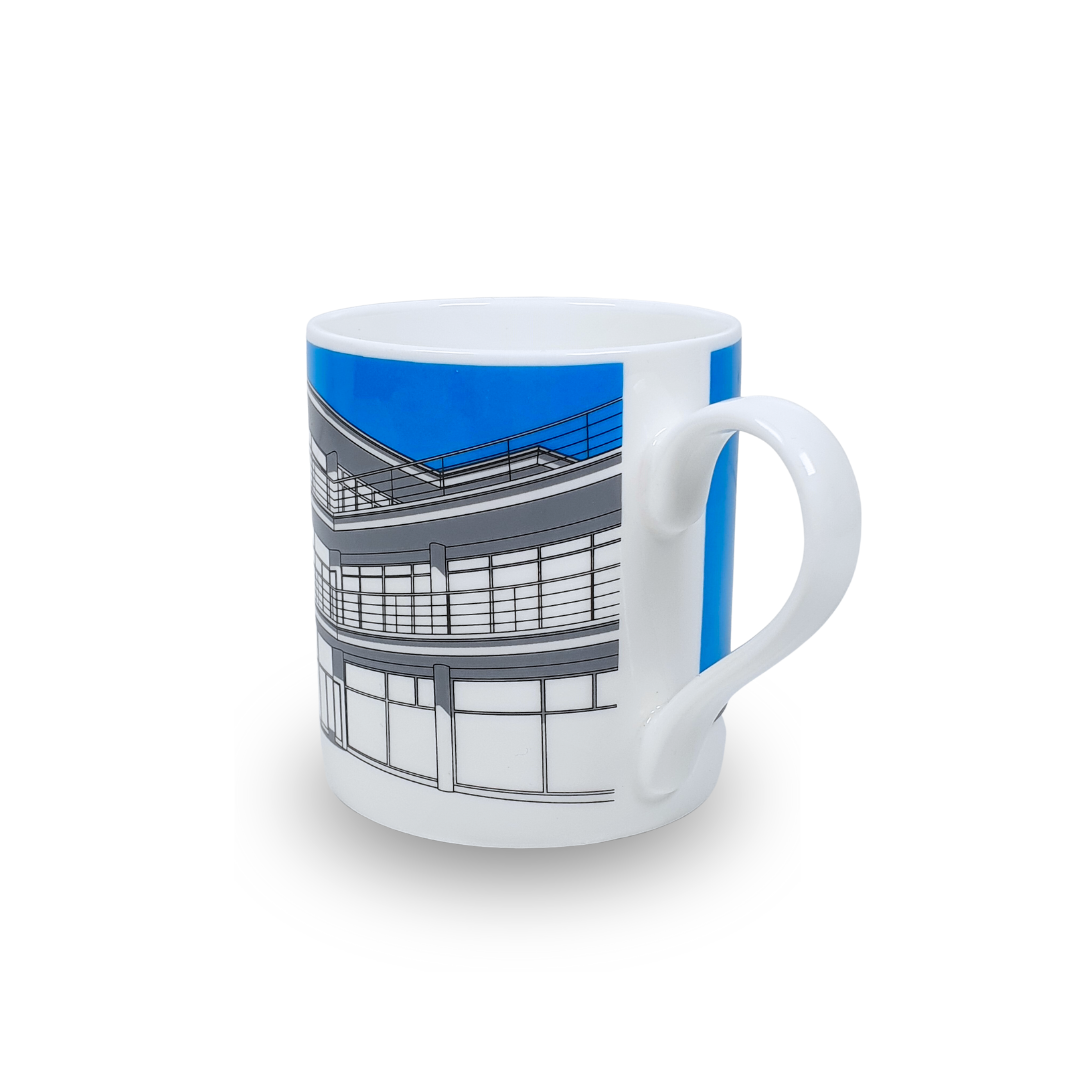 White mug with grey illustration of De La Warr Pavilion with a blue background