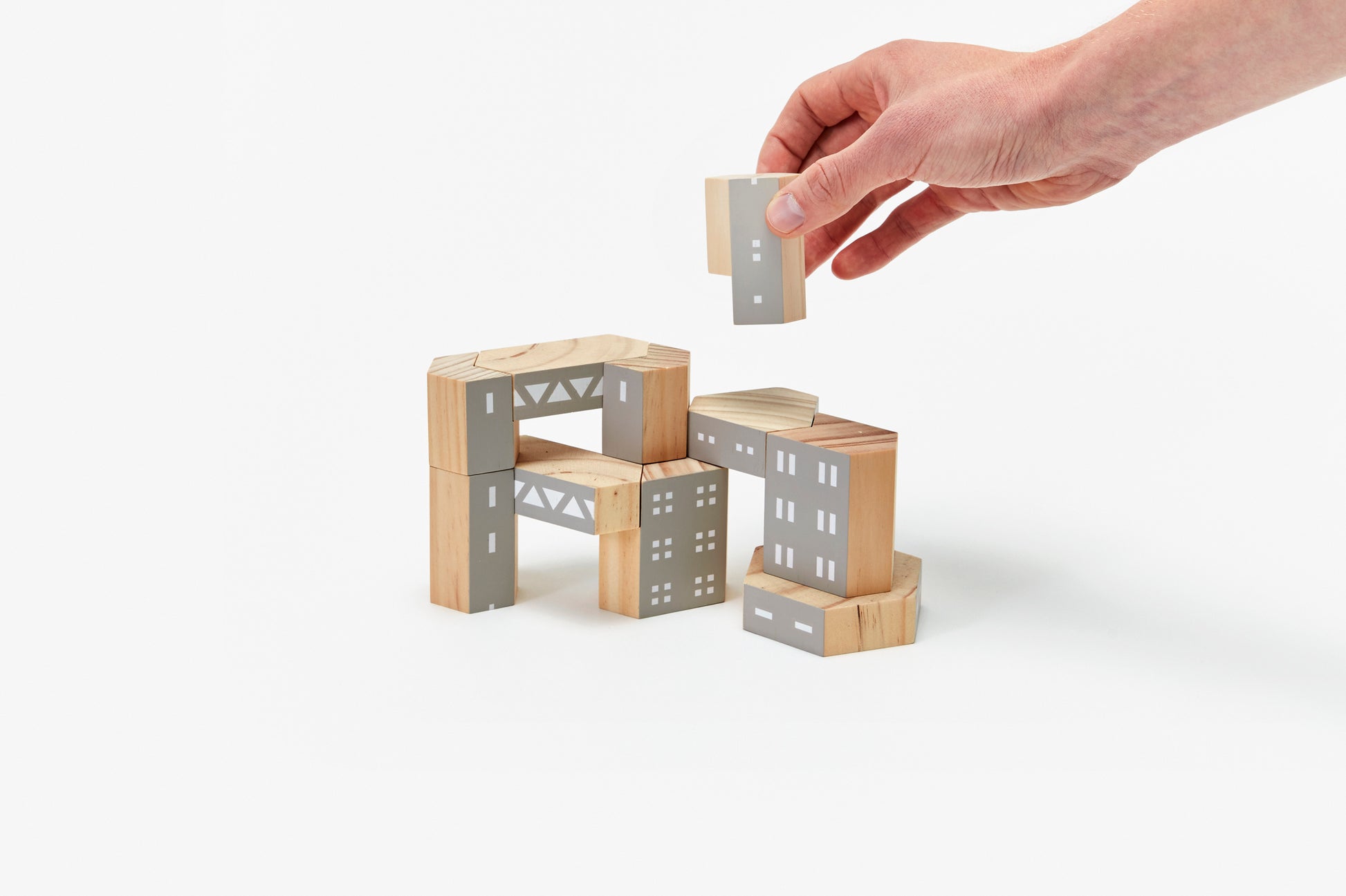 Wooden building blocks with grey building pattern