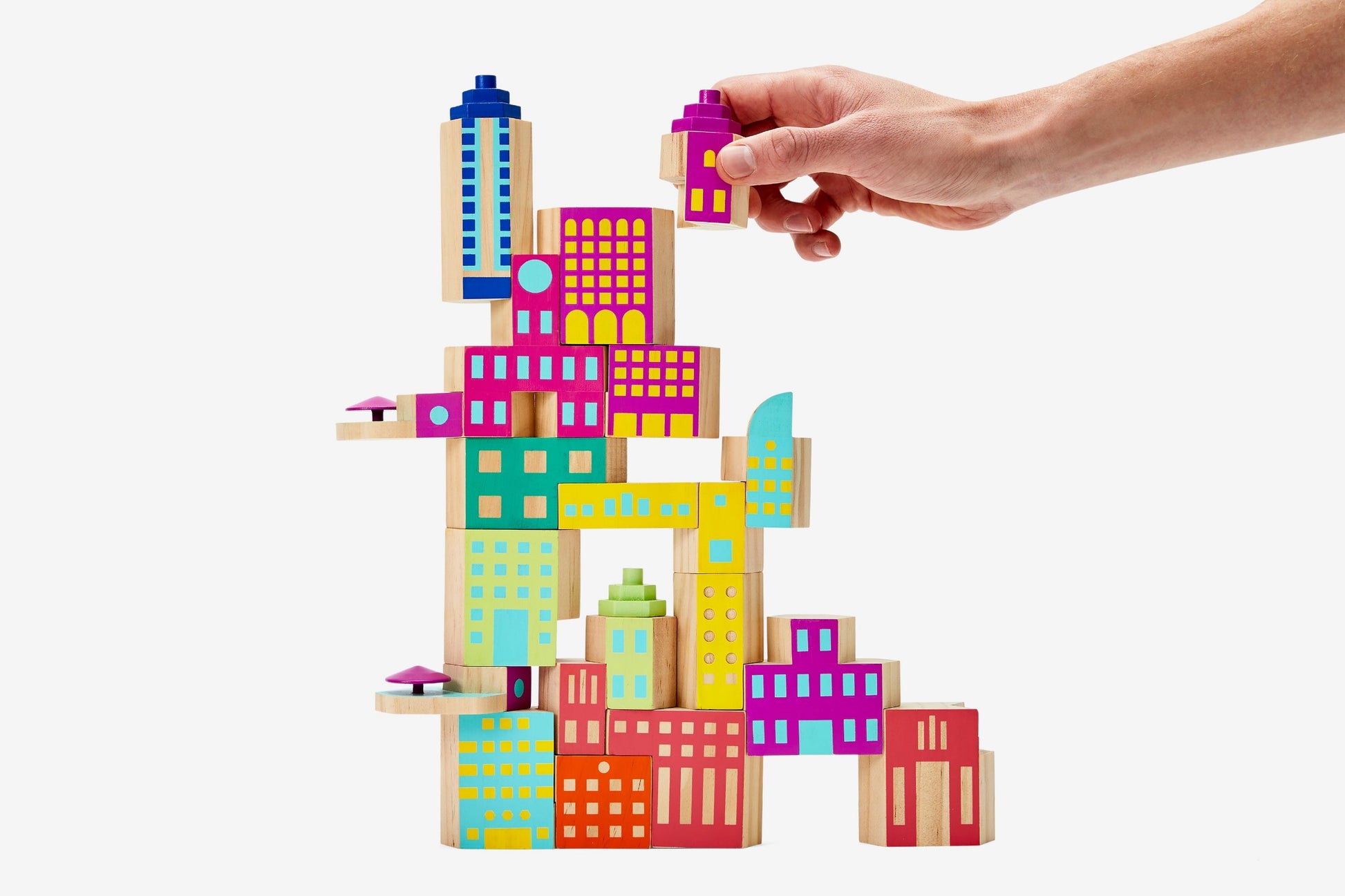 Colourful building blocks in various shapes and sizes painted to look like buildings.
