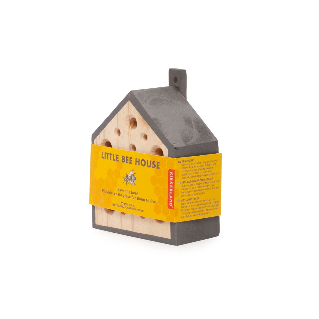 Pinewood bee house,with the outside painted grey. It has a yellow packaging around it.