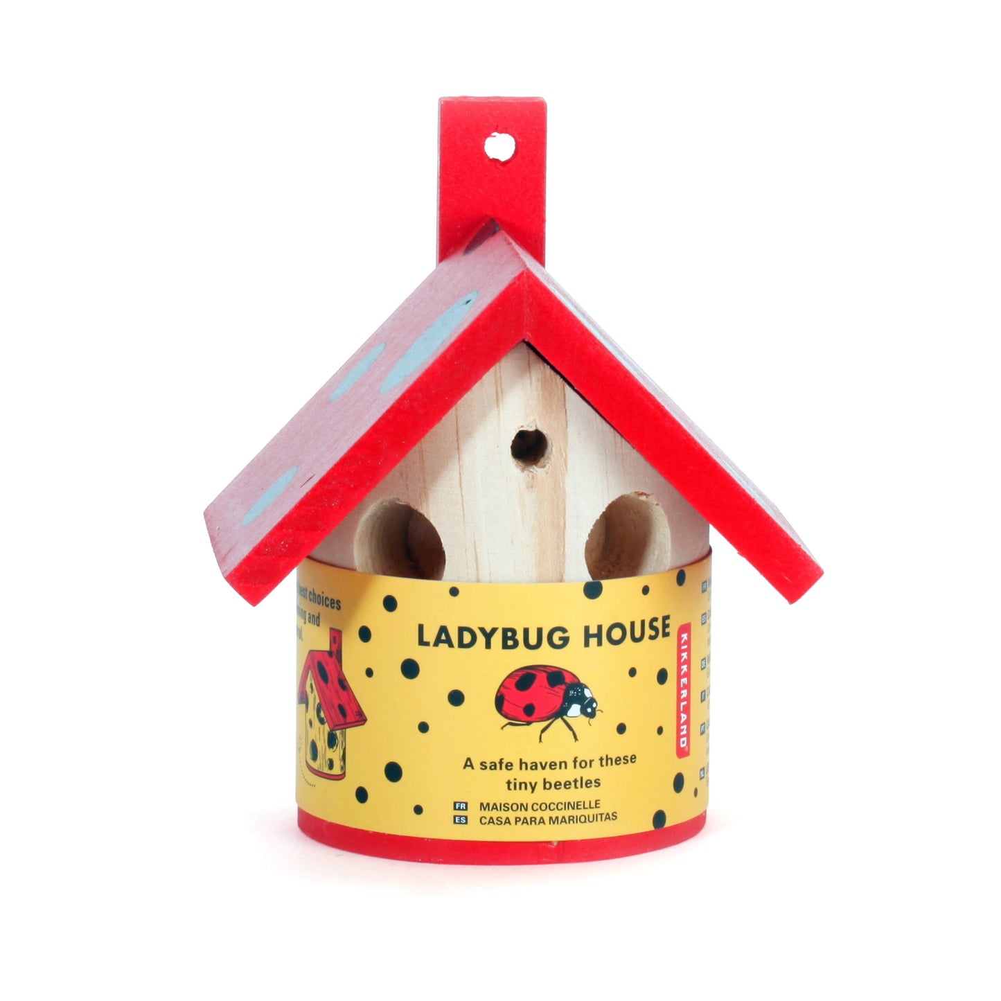 Pinewood ladybird house with a red spotty roof and yellow packaging.