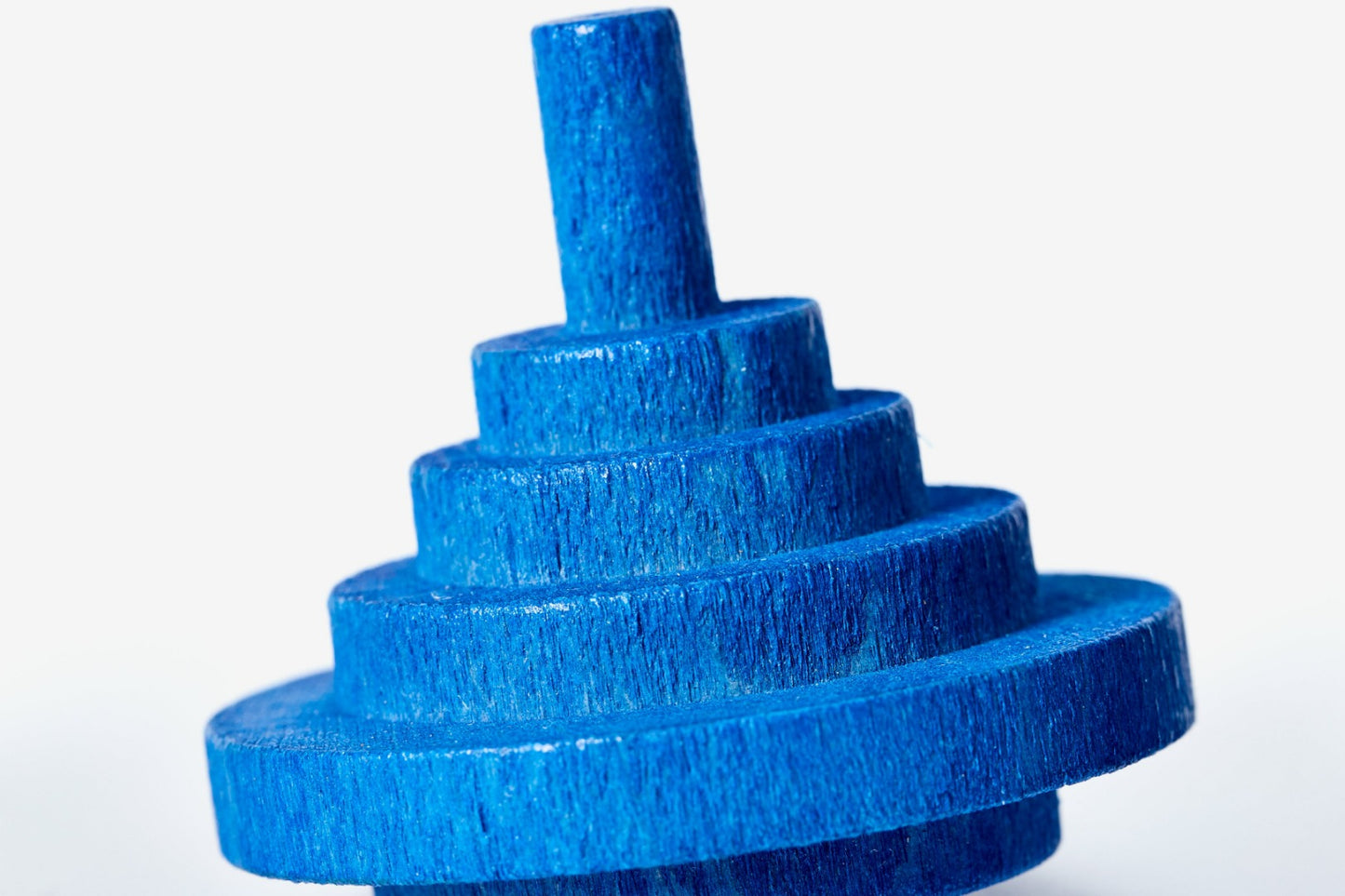 close up of blue spinning top