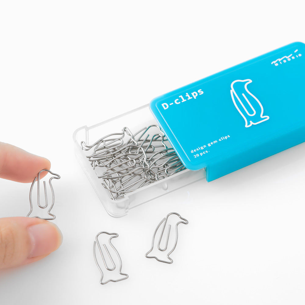 Penguin shaped paper clips in slide-open bluebox.