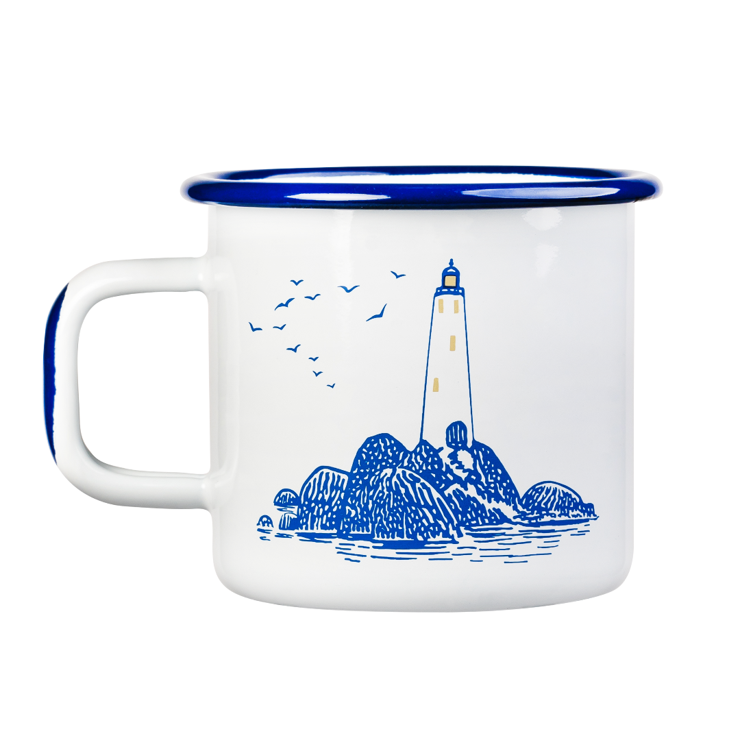 White and blue enamel mug featuring an image a lighthouse on the rocks