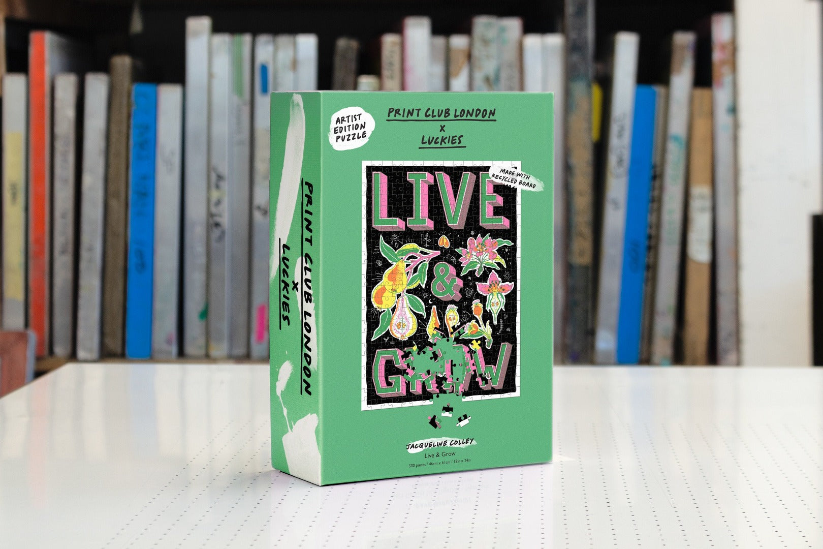 Box for Jigsaw puzzle with words 'Live & Grow' and botanical illustrations.