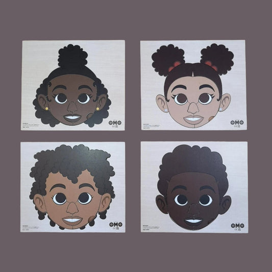 four puzzles with faces of four children with different skin tones.