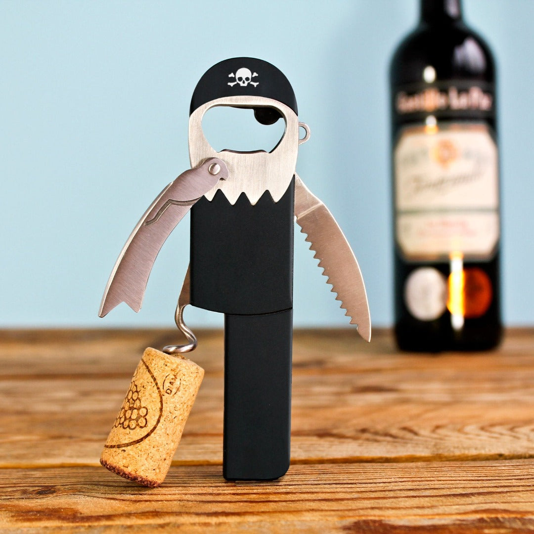 Corkscrew that looks like a pirate with a peg leg, with a bottle of wine in the background