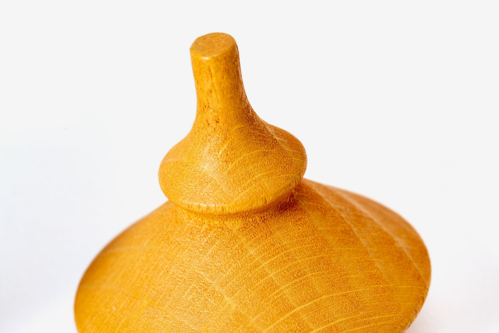close up of yellow spinning top