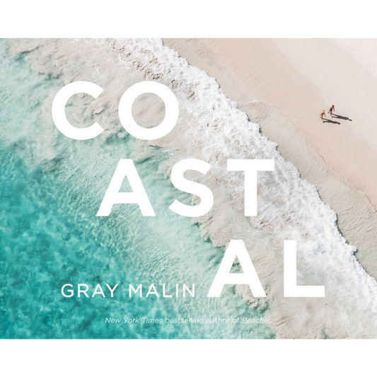 front cover of Coastal by Gray Malin with image of two people walking along beach