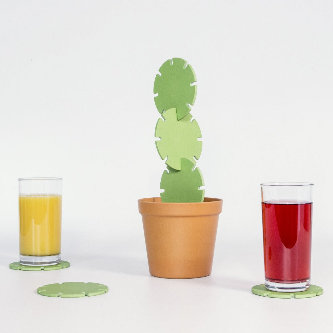green coasters interlocked to resemble a cactus in a pot