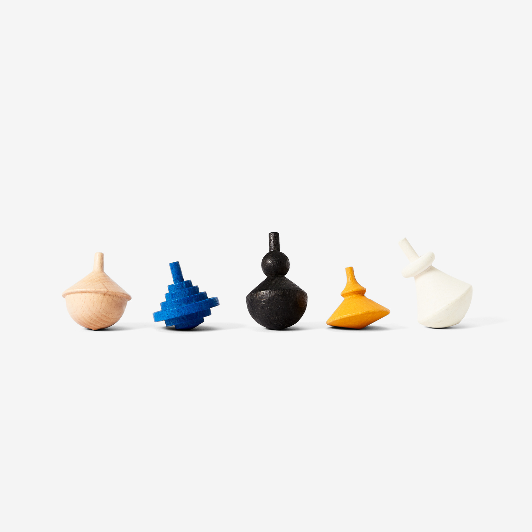 5 wooden spinning tops in brown, blue, black, yellow, and white